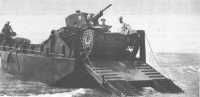 Army light tank is 
unloaded from its landing craft during joint Army-Marine amphibious exercises at New River, N