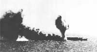 Japanese carrier Shoho, 
dead in the water and smoking from repeated bomb and torpedo hits, was sunk by carrier planes in the Coral Sea Battle