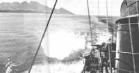 Naval gunfire support for 
the Army-Marine advance up the north coast of Guadalcanal is provided by the 5-inch guns of an American destroyer