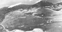 Simpson harbor and Rabaul 
appear in a composite aerial photograph taken during an Allied air raid prior to the Bismarck Sea battle
