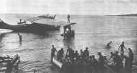 Casualties from the 
fighting on Dragons Peninsula are readied for evacuation from Enogai by PBY