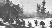 Marines wading ashore on 
D-Day at Bougainville, as seen from a beached LCVP