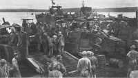 Army amphibian engineers 
and Marines load Army LCMs at Iboki on 5 March for the overnight run to Talasea