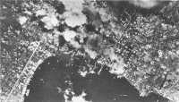 Town of Rabaul shows the 
effect of area saturation bombing in this photograph taken from a Navy SBD during an attack on 22 March 1944