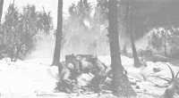 Army 37-mm antitank gun 
fires on enemy pillbox on Kwajalein during 7th Infantry Division advance