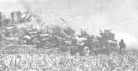 Truck-mounted rocket 
launchers fire at Japanese strongpoints in northern Saipan