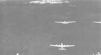 B-29s returning from a 
strike on Japan approach North Field, which was wrested from the jungle battleground of northern Guam