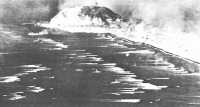 Aerial view of Iwo Jima 
landings as assault waves head for the shore
