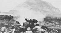 37-mm gun firing on 
Japanese positions on the slopes of Mt