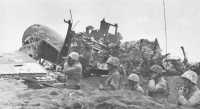 4th Marine Division 
observation post near wrecked enemy aircraft at northern end of Motoyama Airfield No