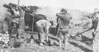 155-mm gun on Iwo Jima at 
moment of firing