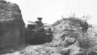 Solidly emplaced tank of 
the Japanese 26th Tank Regiment after capture