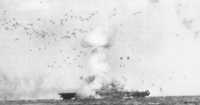 USS Enterprise is hit on 
14 May 1045 by a Kamikaze which dove out of low cloud cover