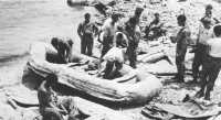 Marine reconnaissance 
personnel prepare rubber boats for landings on Eastern Islands