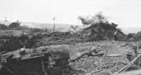 CORKSCREW: Marine assault 
team attacks a Japanese cave after a satchel charge has exploded