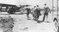 Marine casualties are 
evacuated by a spotter plane from a temporary airstrip north of Itoman