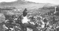 Battered Buddhist figures 
symbolize the atomic destruction suffered at Nagasaki