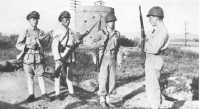 Chinese nationalist 
sentries relieve Marine bridge guards at Chinwangtao in October 1946
