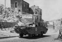 The versatile DUKW bringing 
in supplies to Seventh Infantry troops in Port Empedocle