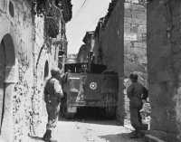 39th Infantry half-track 
squeezing through a narrow street in Cerami
