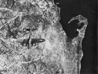 Smoke pall covers portions 
of Messina after bombing attack by B-17’s