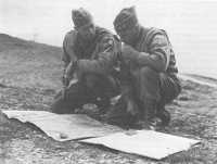 Generals Clark and Keyes 
study the II Corps situation map near Firenzuola, September 1944