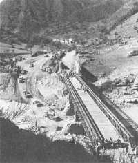 Truck crossing a steel 
truss Bailey Bridge in Apennines