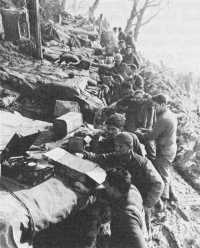Soldiers relaxing during 
lull in battle