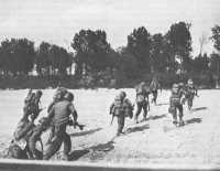 American troops storm 
ashore after assault crossing of Po River