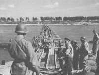 Placing a steel treadway 
bridge across the Po