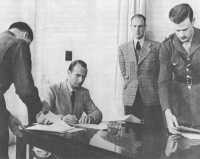 German representatives sign 
surrender document