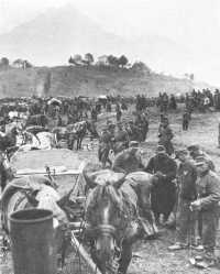 Prisoners of war assemble 
at foot of Alps