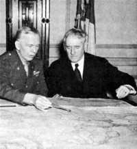 Secretary Stimson confers 
with General Marshall, January 1942