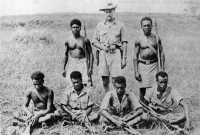 Captain Martin Clemens 
and a group of his native scouts