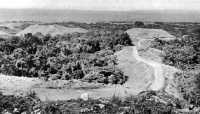 Photographed from Hill 29 
in January 1943, Wright Road is seen winding northward to the coast
