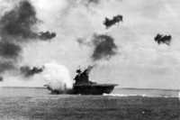 USS Yorktown under Japanese 
fire during the Battle of Midway