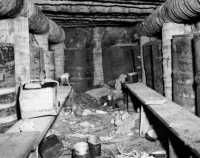Interior of coconut log 
bunker reinforced with sand-filled oil drums near Duropa Plantation