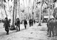 126th infantrymen passing 
through Hariko on their way to the front lines
