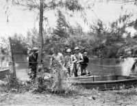 Collapsible assault boats 
being used by 127th Infantrymen to cross the Siwori Creek