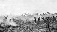 Clearing airfield site with 
hand tools, Kiriwina Island, July 1943