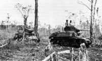 Light tanks M3 of the 9th 
Marine Defense Battalion supporting infantry action near the base of Bibilo Hill