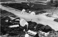 Vunakanau airfield is 
attacked by low-flying bombers dropping parachute bombs