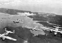 B-25s leaving Bougainville 
after an attack on airfields and supply areas