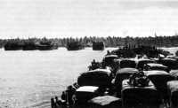 LSTs loaded with troops and 
equipment landing at Salami Plantation