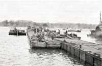 Pontoon causeway and barge 
in Charan Kanoa harbor