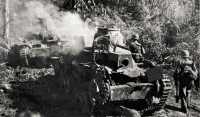 Smoldering Japanese tanks 
knocked out on Agat-Sumay Road by U