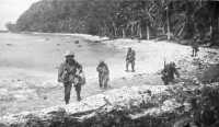 Patrol of Company F, 6th 
Rangers, at Desolation Point (above), and investigating a native village on Dinagat Island (below)