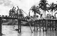 Engineer troops of the 13th 
Engineer Battalion rebuild a bridge near Burauen