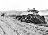 Attempting to reach Kochi 
through Onaga, south of Skyline Ridge, these tanks (below) were lost 29 April when the American lead tank blocked the 
road forward