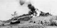 Attacks on Hill 60 by 
marines developed into a tank, flame, and demolitions battle